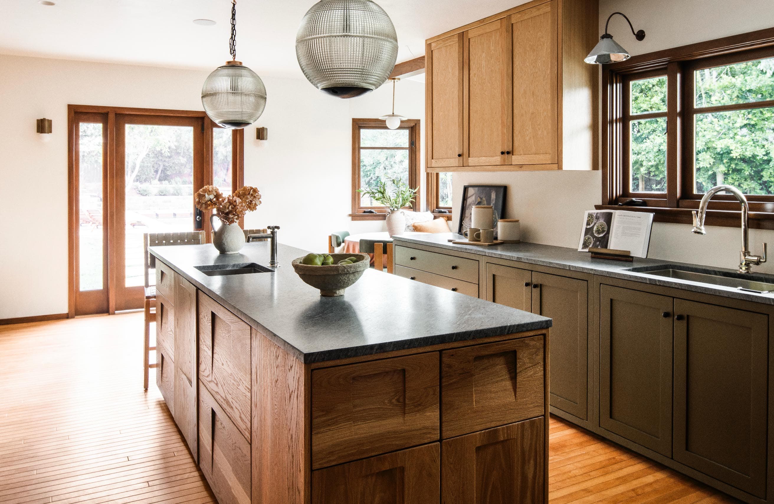 Craftsman kitchen with globe pendants and soapstone countertops